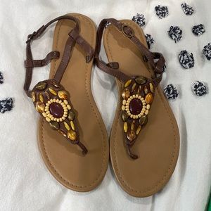 Hardly work tan flats with pattern.